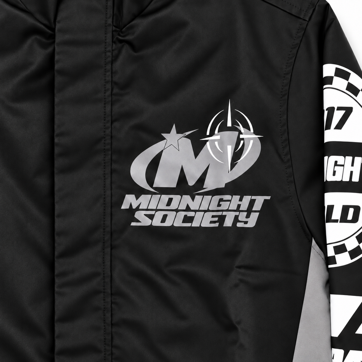 Shadow Racer Track Jacket — chest detail studio product photograph